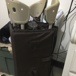 Tan and brown play yard for babies